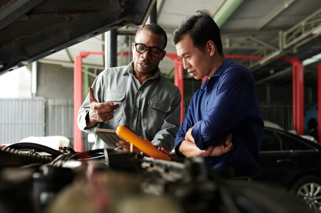 Car Mechanic Talking to Owner